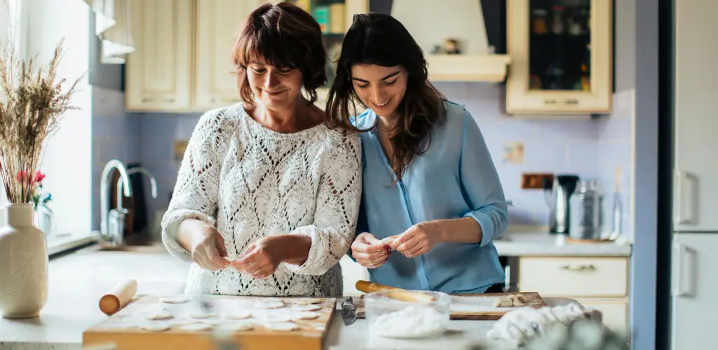Two women baking together - Example of a new shared experience stretching time